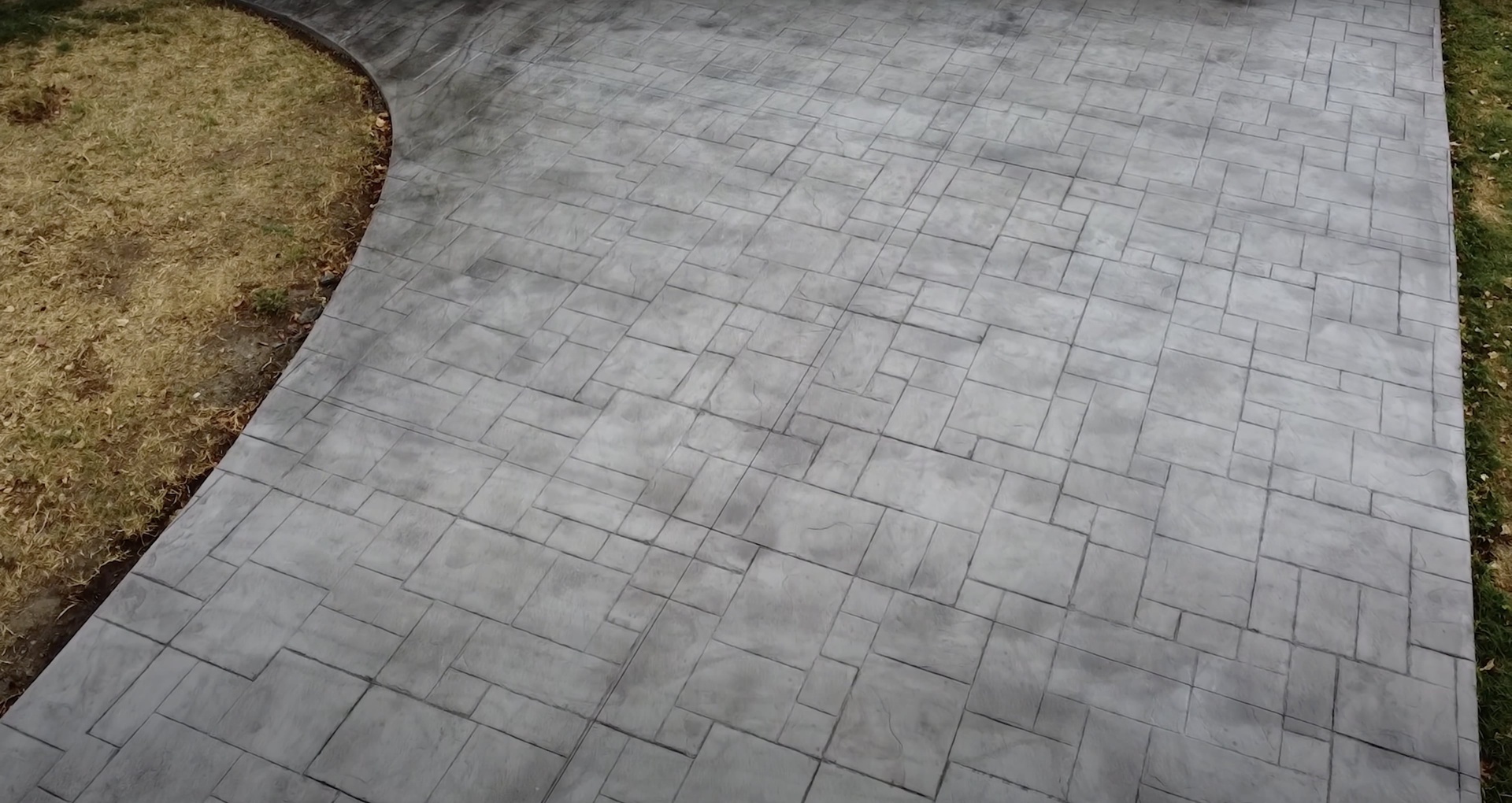 Modern concrete patio with geometric paver pattern