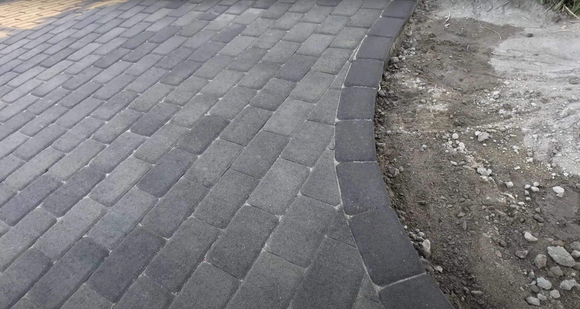 Decorative concrete paver installation with geometric pattern