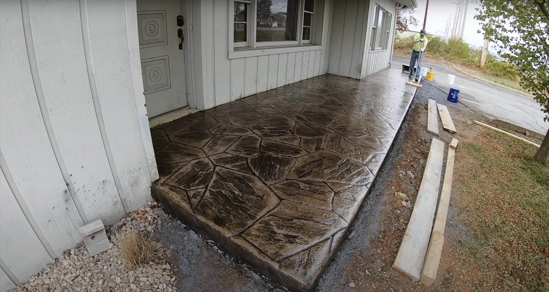 Stamped concrete patio with decorative stone pattern design